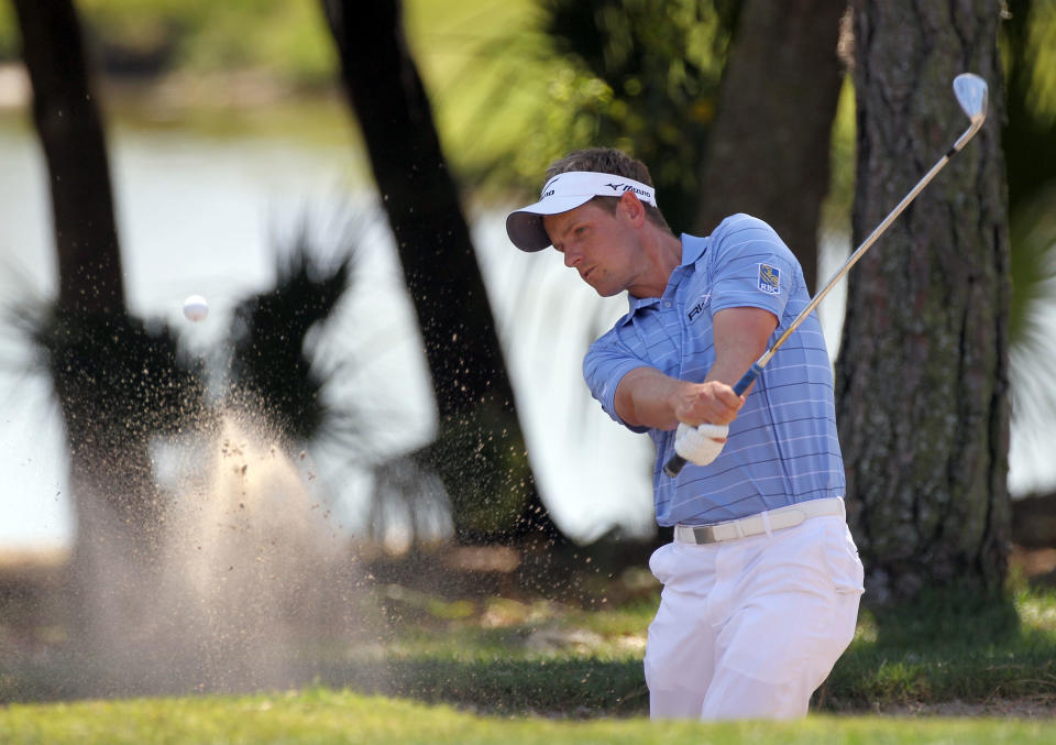 PALM HARBOR, FL - MARCH 17: Luke Donald of England plays a shot on the first hole during the third round of the Transitions Championship at the Innisbrook Resort and Golf Club on March 17, 2012 in Palm Harbor, Florida. (Photo by Sam Greenwood/Getty Images)