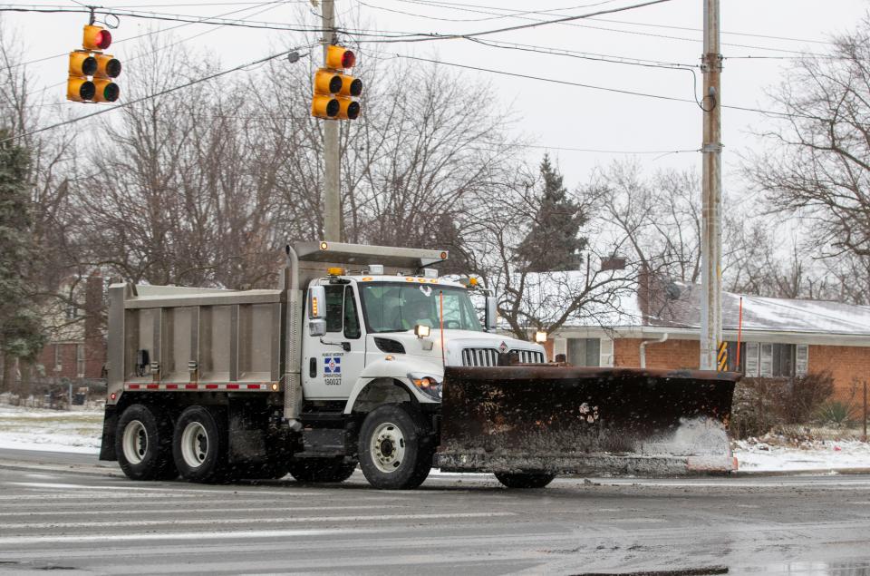 A Department of Public Works road salt and plow truck as about an inch of snow falls on central Indiana, Sunday, Jan. 23, 2022. A little more snow could fall Monday morning. 