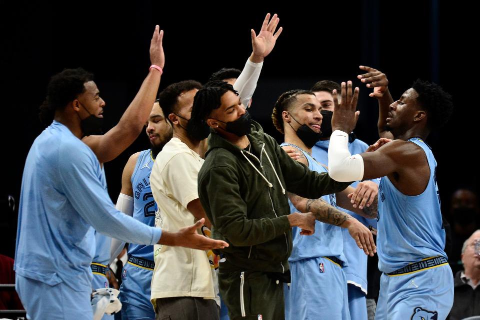 Memphis Grizzlies forward Jaren Jackson Jr., right, greets teammates in a game against the Oklahoma City Thunder, Dec. 2, 2021, in Memphis, Tenn.