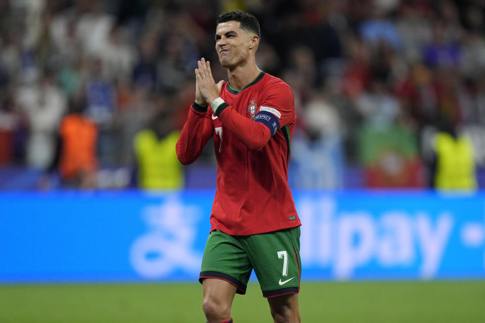 Portugal's Cristiano Ronaldo reacts after scoring in penalties shootouts during a round of sixteen match between Portugal and Slovenia at the Euro 2024 soccer tournament in Frankfurt, Germany, Monday, July 1, 2024. (AP Photo/Matthias Schrader)