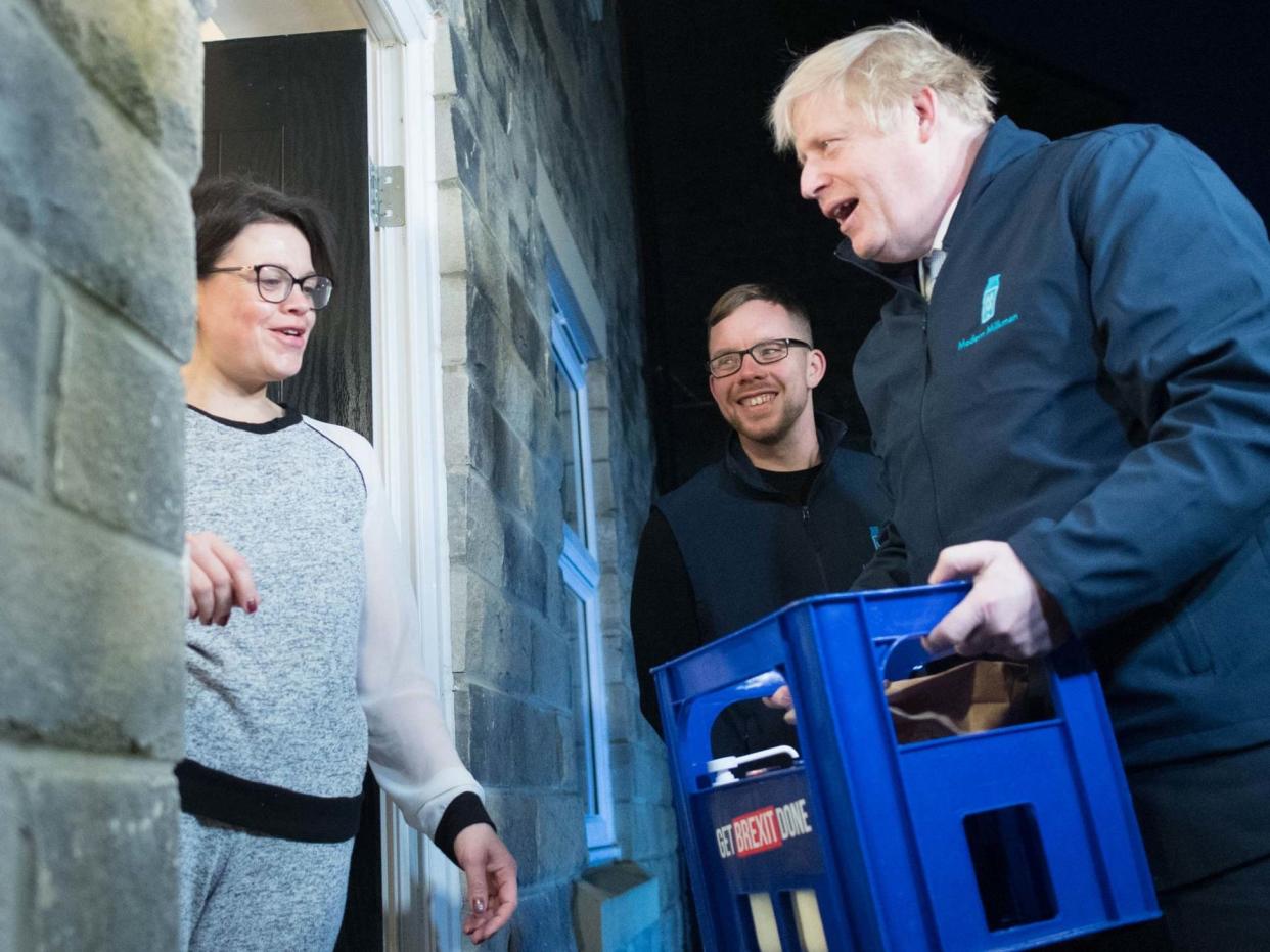 Prime Minister Boris Johnson delivers milk to Debbie Monaghan in Guiseley, Leeds: PA