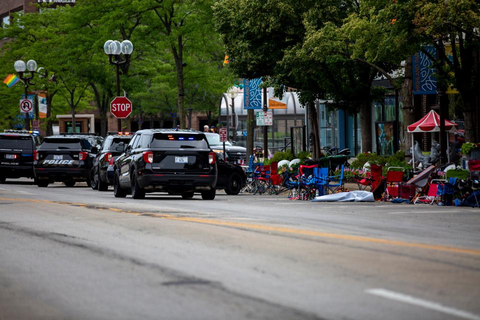 Police vehicles at the scene of the Fourth of July parade shooting in Highland Park, Illinois on Monday.