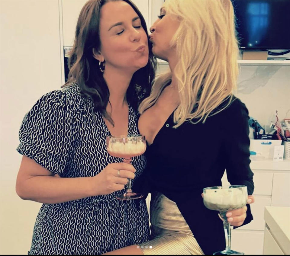 Carrie Bickmore holding a cocktail