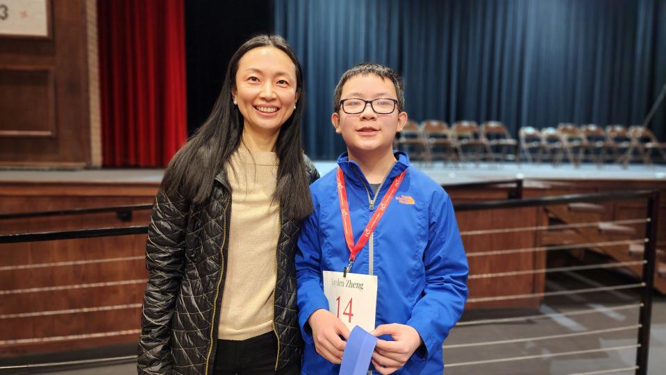 Jauden Zheng, winner of the 2023 Regional Spelling Bee, stands with his mom Barbara Wang Saturday at Tascosa High School in Amarillo.