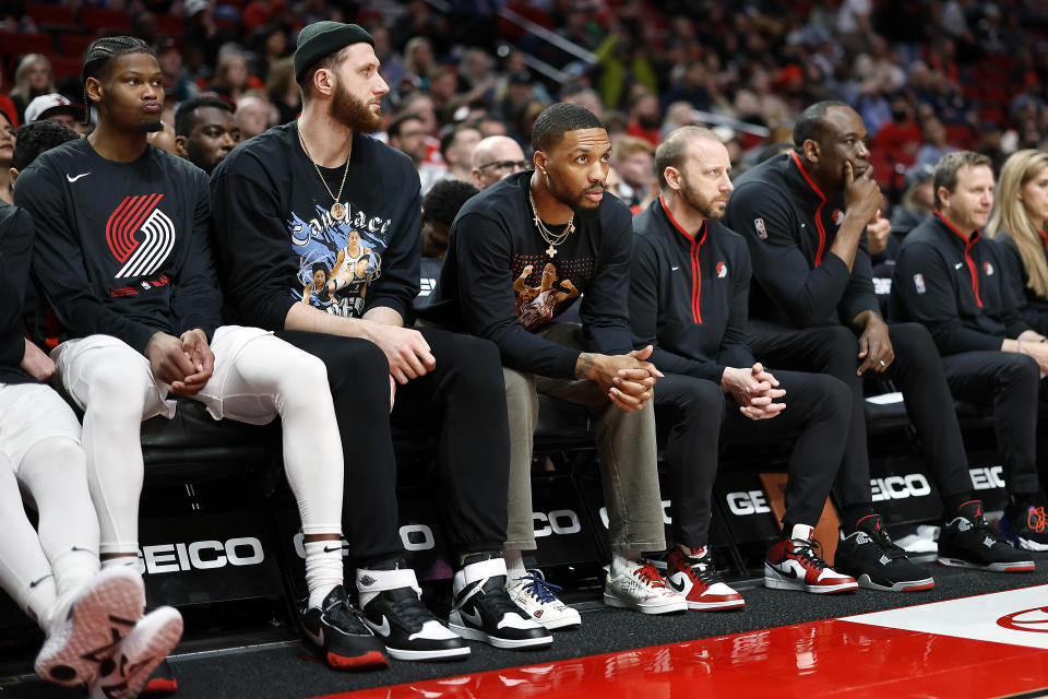 Damian Lillard sits out a game in March after the Trail Blazers shut him down for the season. (Soobum Im/Getty Images)