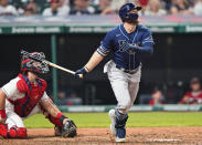 Tampa Bay Rays' Austin Meadows watches his two-run home run next to Cleveland Indians catcher Austin Hedges in the ninth inning of a baseball game Saturday, July 24, 2021, in Cleveland. (AP Photo/Tony Dejak)