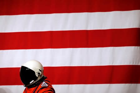 Lead engineer, Dustin Gohmert wears the Orion crew survival spacesuit prototype for the next astronaut to the moon by 2024, during its presentation at NASA headquarters in Washington