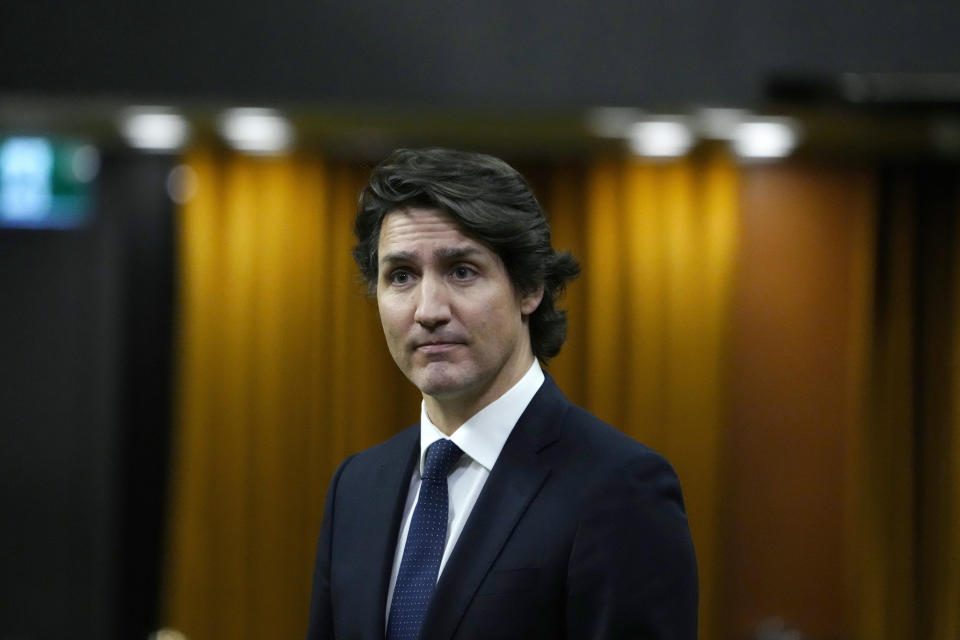 Canadian Prime Minister Justin Trudeau rises during an emergency debate in the House of Commons on the situation in Ottawa, as a protest against COVID-19 restrictions that has been marked by gridlock and the sound of truck horns continues into its second week, in Ottawa, Ontario, Monday, Feb. 7, 2022. (Justin Tang/The Canadian Press via AP)