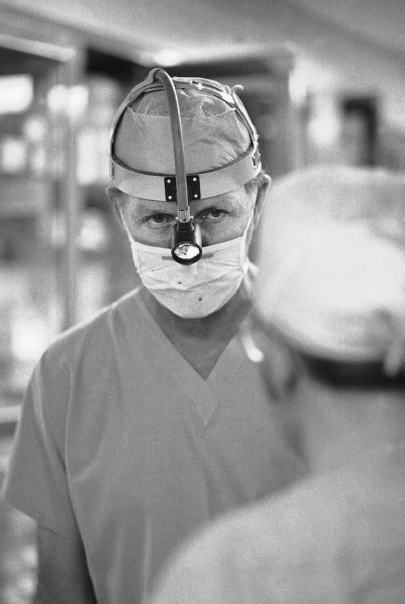 Surgeon Denton A. Cooley as he leaves an operating room on March 16, 1978 at the Texas Heart Institute.