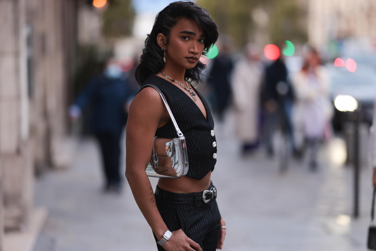 Bretman Rock seen wearing a black vest, black pants and a belt and a silver shiny handbag outside Alessandra Rich during Pariser Fashion Week on September 30, 2022 in Paris, France. (Photo by Jeremy Moeller/Getty Images)