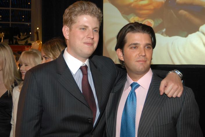 Eric Trump and Don Jr. pose together at Don Jr.'s birthday party on December 11, 2006.