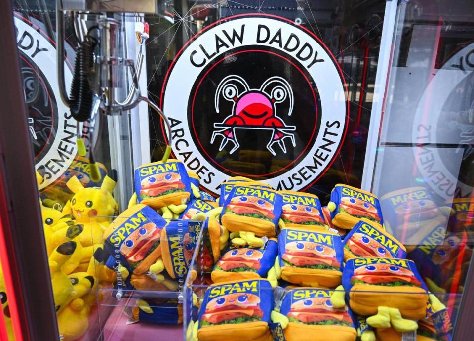 Spam can plush toys are featured in one of the claw machine games at Claw Daddy arcade at Fashion Fair in Fresno on Tuesday, Aug. 22, 2023.