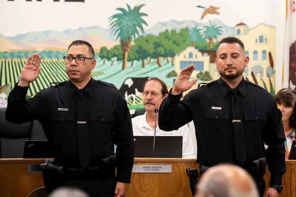 Gustine Reserve Officers Arthur Rincon, left, and Emanuel Gonzalez, right, are sworn in during a swearing in ceremony for four new Gustine Police Department Reserve Officers in Gustine, Calif., on Tuesday, June 20, 2023. Andrew Kuhn/akuhn@mercedsun-star.com