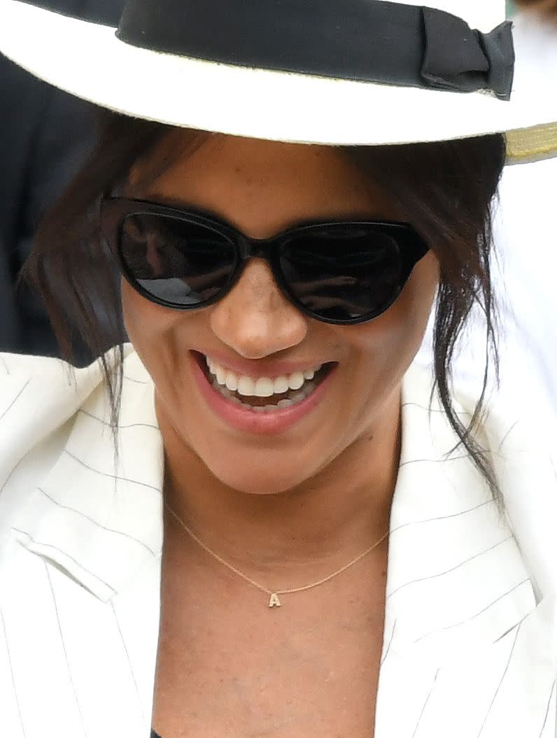 <p>Meghan has quite the collection of symbolic yet simple gold necklaces. She wore a tiny "A" necklace to Wimbledon in 2019 as a nod to her son, Archie. <br></p>