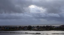 Sunshine makes its way through a break in the clouds on Tuesday, Sept. 22, 2020, in Surfside Beach, Texas. Beta has weakened to a tropical depression as it parked itself over the Texas coast, raising concerns of extensive flooding in Houston and areas further inland. (Godofredo A. Vasquez/Houston Chronicle via AP)