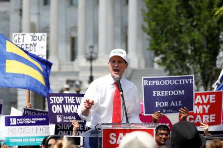 Sen. Ron Wyden (D-OR) speaks during a demonstration against the Republican repeal of the Affordable Care Act, outside the U.S. Capitol in Washington, U.S., June 21, 2017. REUTERS/Aaron P. Bernstein