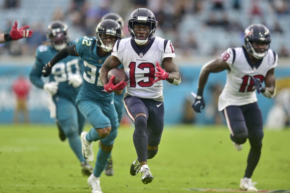 Houston Texans wide receiver Brandin Cooks (13) scores the final touchdown for Houston as Jacksonville Jaguars cornerback Tyson Campbell (32) can't make the tackle during the fourth quarter Sunday, Dec. 2021 at TIAA Bank Field in Jacksonville. The Jaguars hosted the Texans during a regular season NFL game. Houston defeated Jacksonville 30-16. [Corey Perrine/Florida Times-Union]