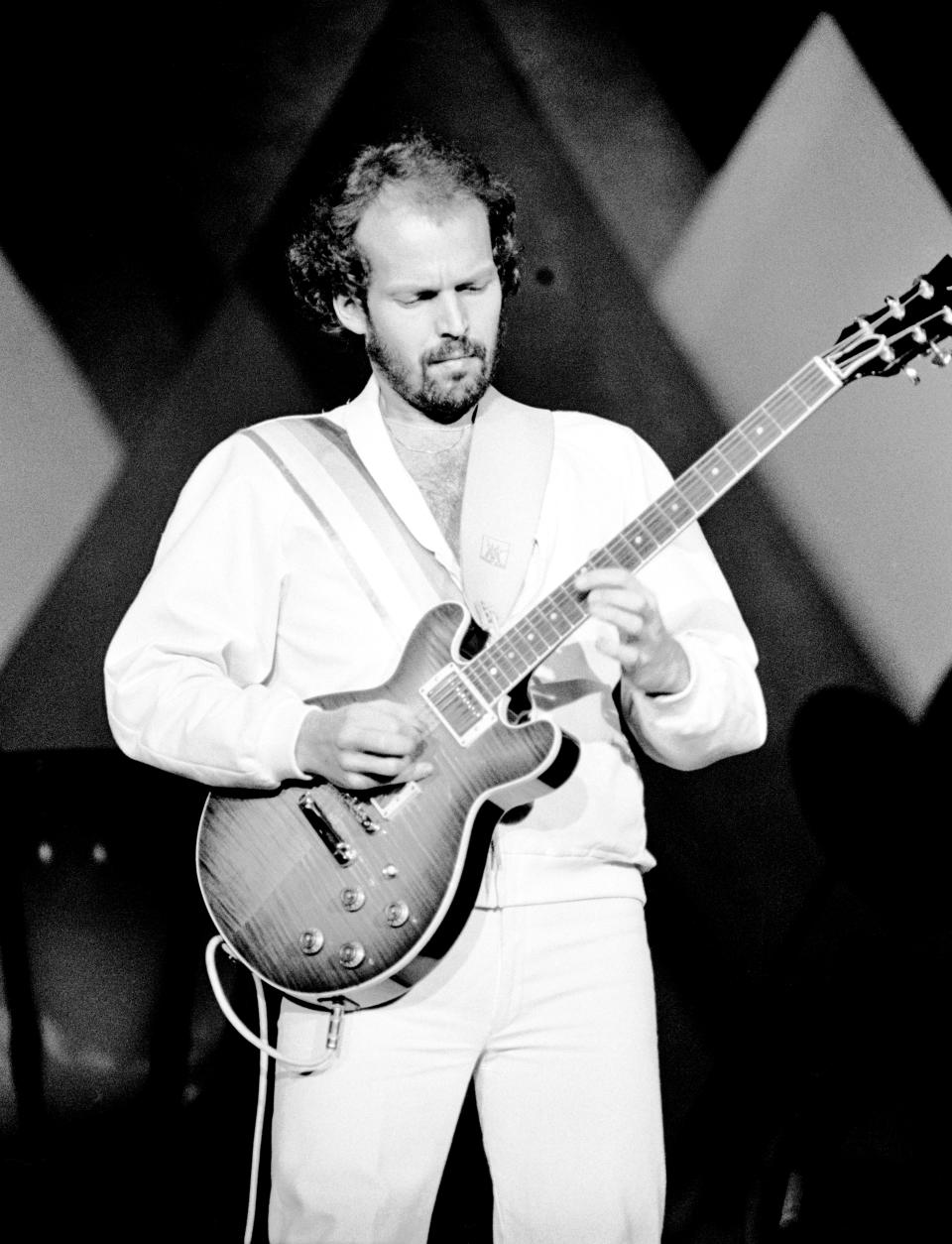 Lasse Wellander, ABBA’s touring guitarist performs on stage at the Wembley Arena, London, England, on November 5th, 1979. (Photo by Gus Stewart/Redferns)