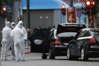 Forensics officers inspect the car of former Greek prime minister and former central bank chief Lucas Papademos following the detonation of an envelope injuring him and his driver, in Athens, Greece, May 25, 2017. REUTERS/Costas Baltas