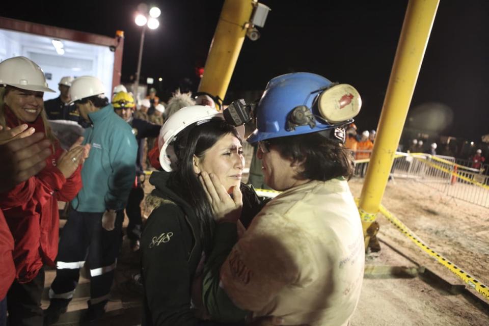<div class="inline-image__caption"><p>Miner Osman Araya hugs his wife after arriving as the sixth miner to be hoisted to the surface in Copiapo October 13, 2010. Chile's 33 trapped miners are set to travel nearly half a mile through solid rock in a shaft just wider than a man's shoulders on Tuesday night, as their two month ordeal after a cave-in draws to an end.</p></div> <div class="inline-image__credit">Hugo Infante-Government of Chile/Reuters</div>