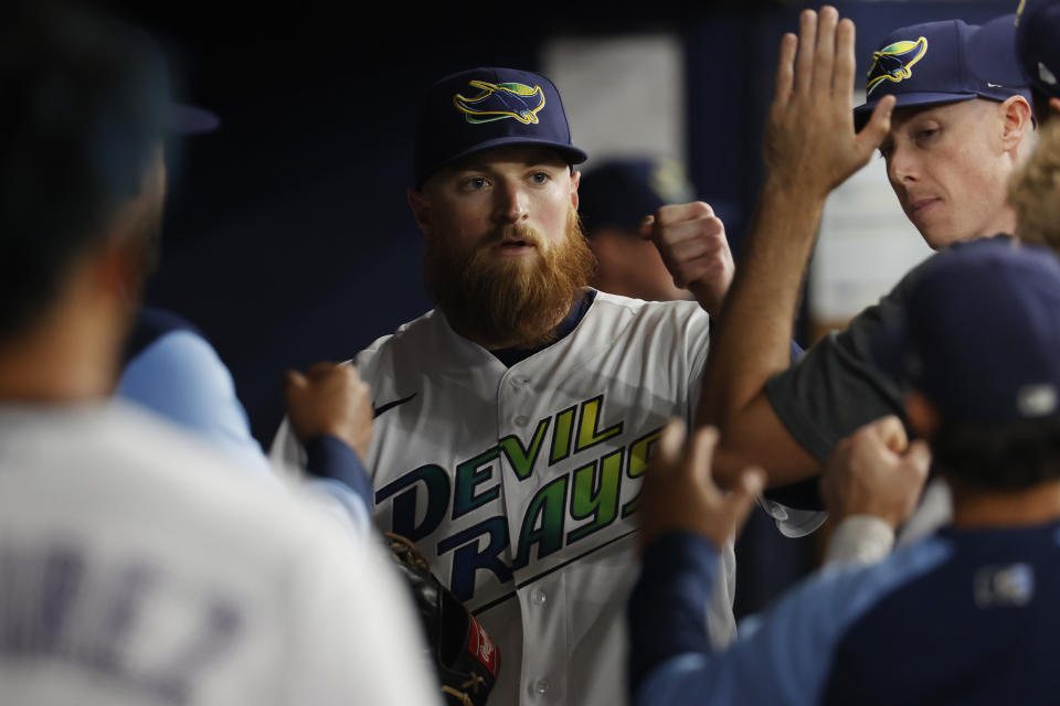 Tampa Bay Rays starting pitcher Drew Rasmussen walks into the dugout after being removed during the seventh inning of the team's baseball game against the Toronto Blue Jays on Saturday, Sept. 24, 2022, in St. Petersburg, Fla. (AP Photo/Scott Audette)