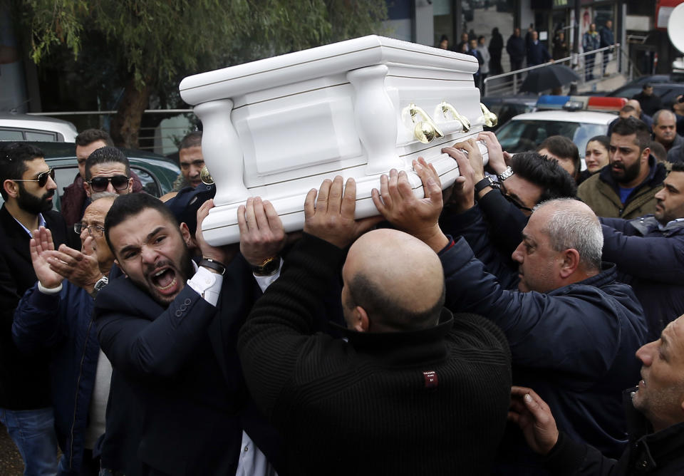 Relatives and friends of Elias Wardini, a Lebanese man who was killed in the New Year's Eve Istanbul nightclub attack, carry his coffin during his funeral procession, in Beirut, Lebanon, Tuesday, Jan. 3, 2017. The gunman killed 39 people, most of them foreigners, including three Lebanese citizens, at the Istanbul nightclub. The Islamic State group claimed the attack on Monday, saying a "soldier of the caliphate" had carried out the mass shooting in response to Turkish military operations against IS in northern Syria. (AP Photo/Hussein Malla)