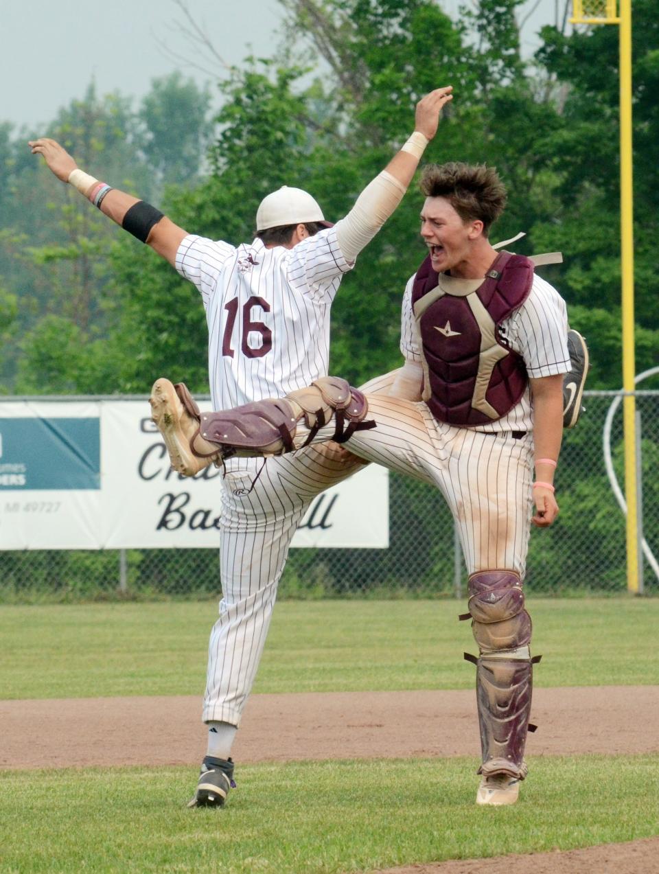Charlevoix's Ryan Pearl (right) and Hunter Lemerand celebrate in the seconds after the final out Saturday.