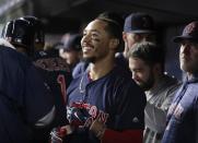 Boston Red Sox's Mookie Betts celebrates with teammates after hitting a three-run home run during the eighth inning of a baseball game against the New York Yankees on Thursday, Sept. 20, 2018, in New York. (AP Photo/Frank Franklin II)