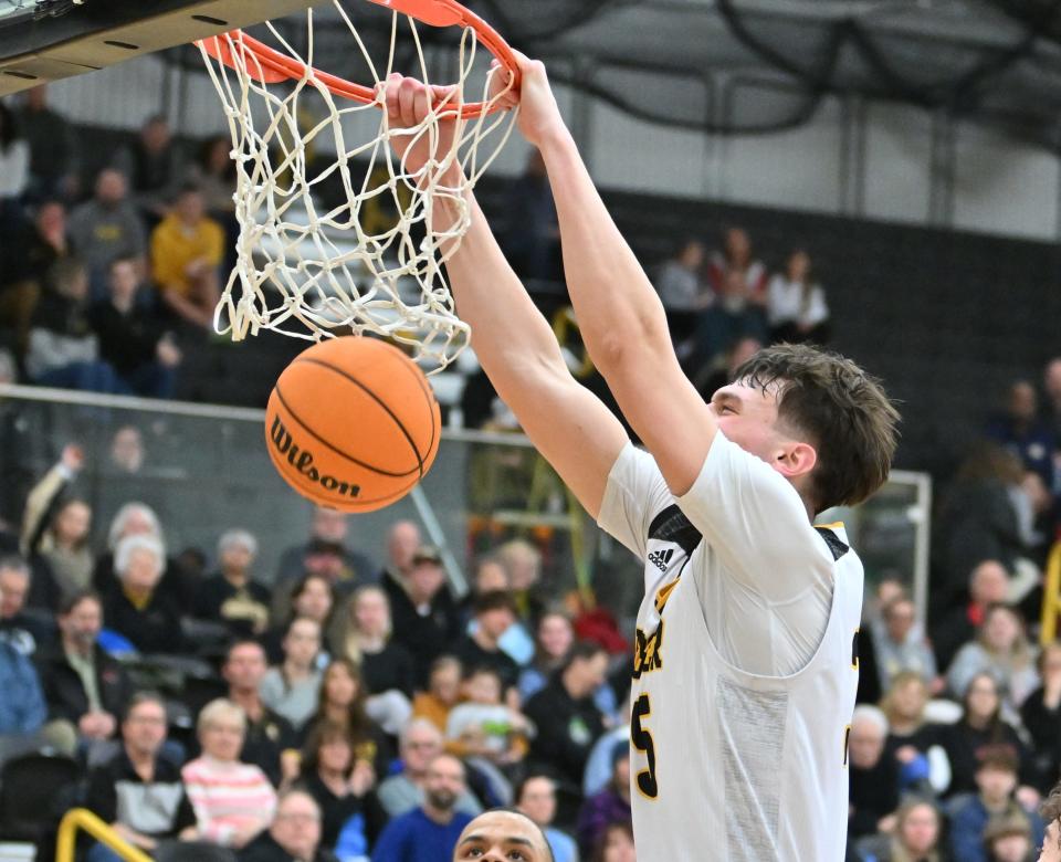 Wooster's Nick Everett dunks during a game.