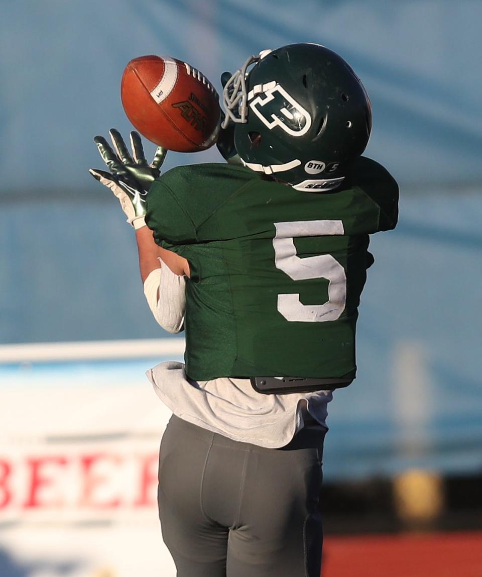 Pleasantville's Erik Coleman (5) catches a first-half touchdown pass against Ravena during the Class B football state semifinal at Middletown High School Nov. 26, 2022.