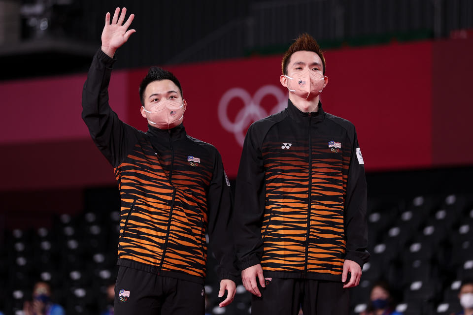 Aaron Chia(left) and Soh Wooi Yik standing on podium