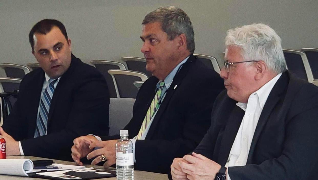 Dover Mayor Shane Gunnoe (Left); Scott Ryan, chief of community engagement for the Ohio Department of Development; and New Philadelphia Mayor Joel Day attend an event at First Federal Community Bank, in which the Dover-New Philadelphia area was recognized as one of the top micropolitan areas in the country.