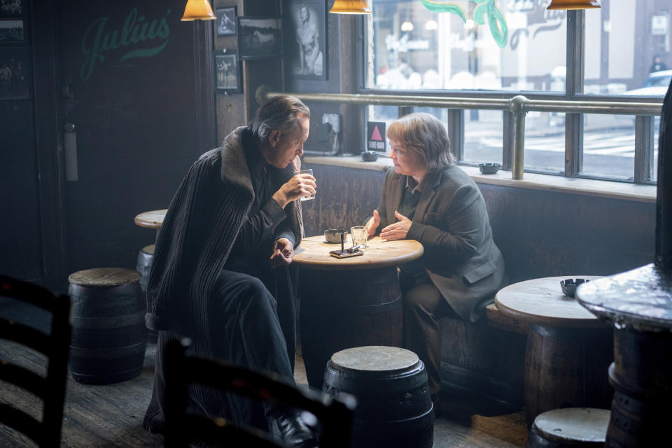 This image released by Fox Searchlight Pictures shows Richard E. Grant, left, and Melissa McCarthy in a scene from "Can You Ever Forgive Me?" (Mary Cybulski/Fox Searchlight Pictures via AP)