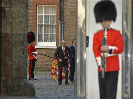 Britain's Prince Philip arrives for the christening of Prince George at St James's Palace in London