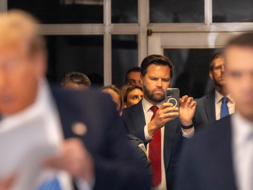 Sen. JD Vance snaps a photo at the trial on May 13.