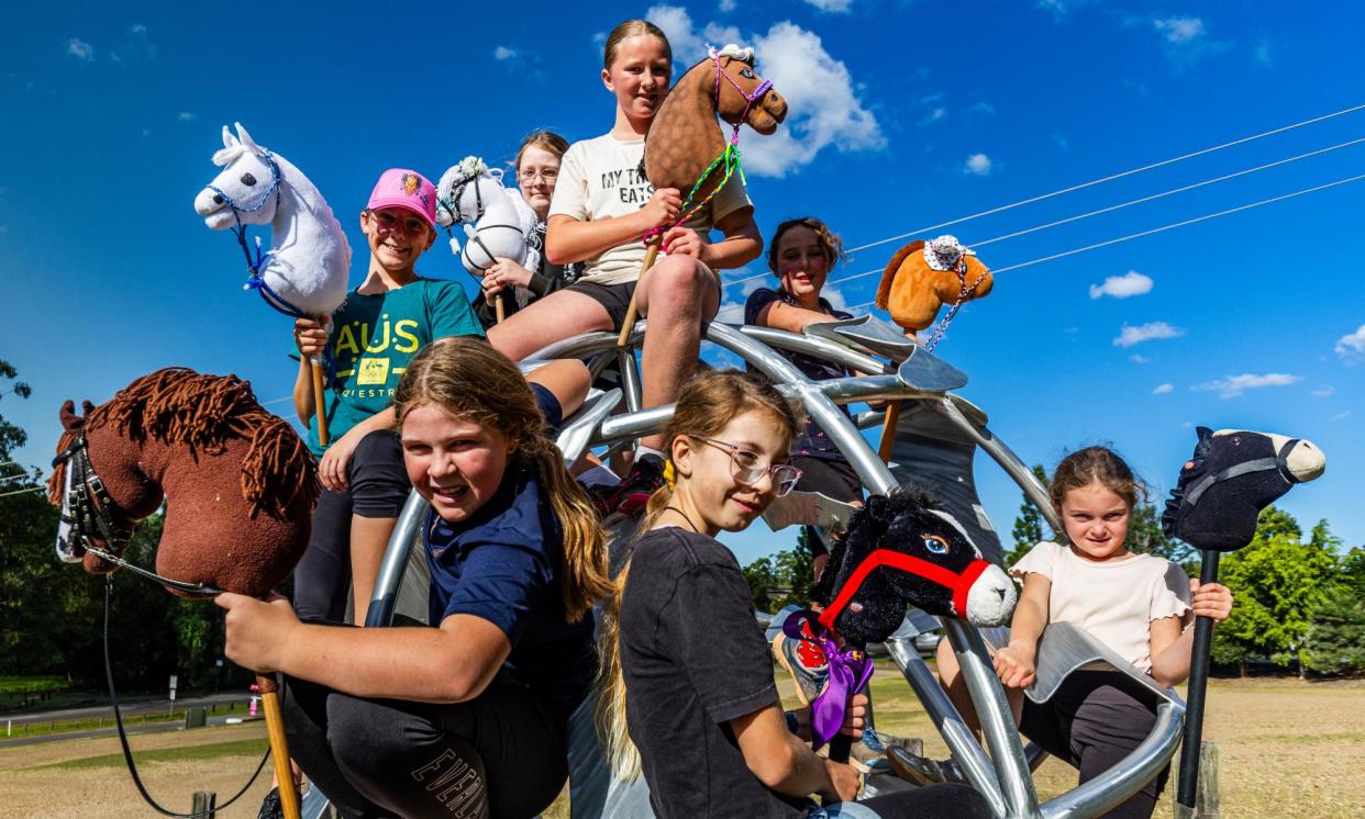 <span>At a training session for the hobby horse competition in Eumundi, Queensland are, top left to right: Natalie, Adelaid, Khloe, Lily. Front left to right are: Asha, Jasmine Oakes and Jasmine Francis.</span><span>Photograph: Paul Hilton/The Guardian</span>