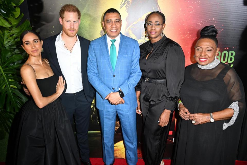 PHOTO: Meghan, Duchess of Sussex, Prince Harry, Duke of Sussex, Andrew Holness, Juliet Holness and Olivia Grange attend the Premiere of 'Bob Marley: One Love' at the Carib 5 Theatre on January 23, 2024 in Kingston, Jamaica. (Jason Koerner/Getty Images)