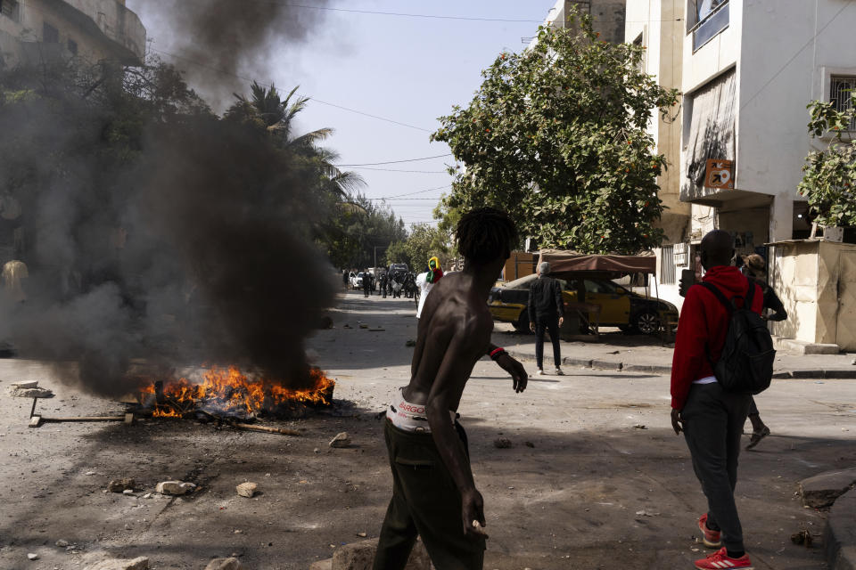 Demonstrators protest President Macky Sall's decision to postpone the Feb. 25 vote, citing an electoral dispute between the parliament and the judiciary regarding some candidacies, in Dakar, Senegal, Friday, Feb. 9, 2024. Opposition leaders and candidates rejected the decision, calling it a "coup." (AP Photo/Stefan Kleinowitz)