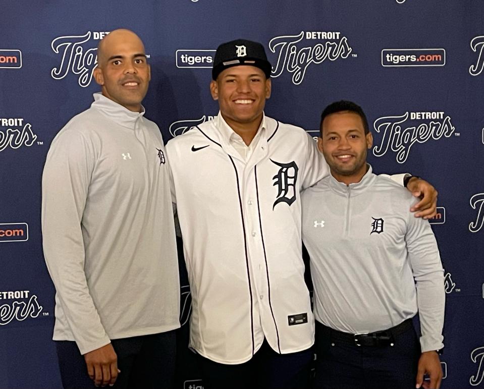 Dominican Republic third baseman Nestor Miranda (middle) signs with the Detroit Tigers on January 15, 2024.