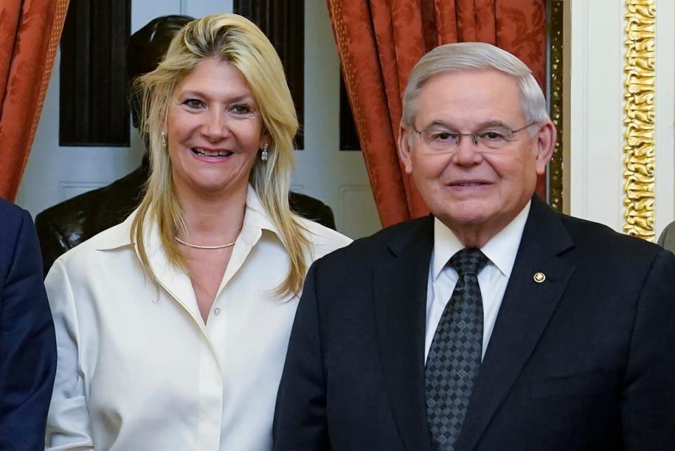 Sen Bob Menendez and his wife Nadine Arslanian, pose for a photo on Capitol Hill in Washington in December 2022 (AP)