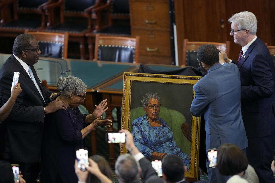 Opal Lee, who worked to help make Juneteenth a federally-recognized holiday, second from left, stands with state Sen. Royce West, left, as her portrait is unveiled in the Texas Senate Chamber, Wednesday, Feb. 8, 2023, in Austin, Texas. (AP Photo/Eric Gay)