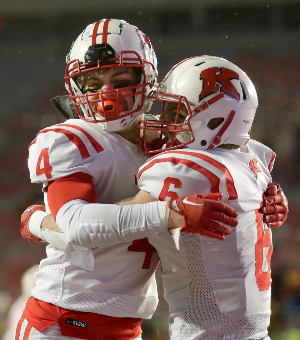 Kimberly's Ethan Doucette (4) and Blake Barry (6) celebrate a fourth-quarter touchdown during the Papermakers' 34-30 victory over Mukwonago in the WIAA Division 1 state title game Nov. 18, 2022, at Camp Randall Stadium in Madison.