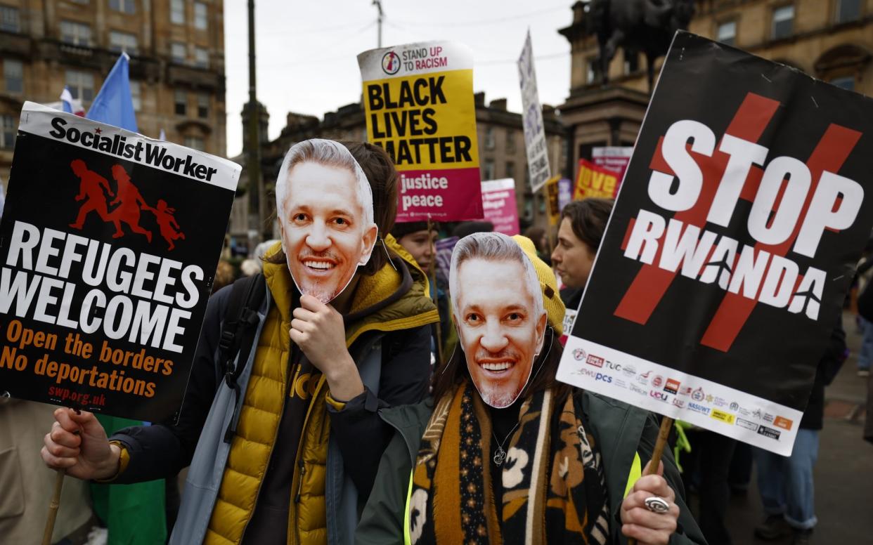 Gary Lineker's comments attracted a mixture of criticism and support, with these protesters wearing masks of the football presenter during a Stand Up To Racism march in Scotland - Jeff J Mitchell/Getty Images