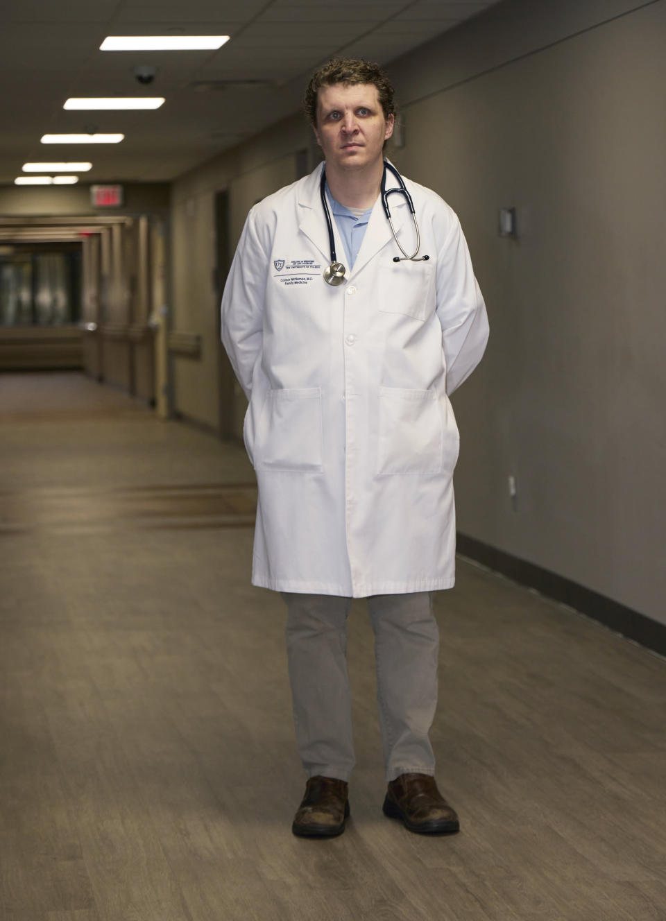 Dr. Connor McNamee, a third-year family medicine resident at the University of Toledo Medical Center, poses at the medical center, Tuesday, Oct. 18, 2022, in Toledo, Ohio. Students in obstetrics-gynecology and family medicine are facing tough choices about where to advance their training in a landscape where legal access to abortion varies from state to state. McNamee began exploring abortion training outside Ohio last summer. A state law bans most abortions after cardiac activity is detected, but a judge has blocked it while a challenge proceeds. (AP Photo/Rick Osentoski)