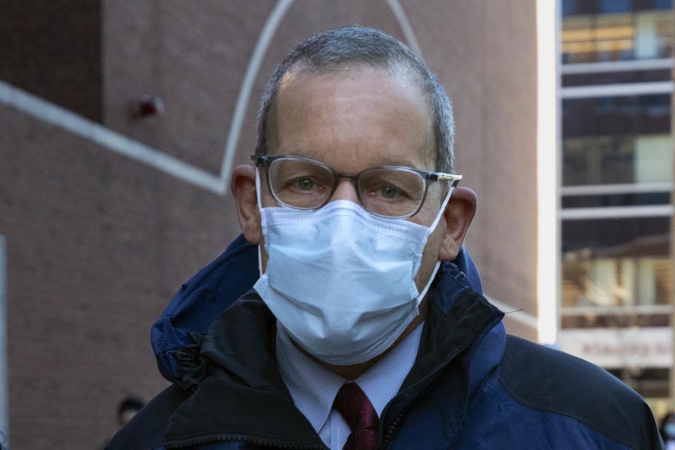 Harvard University professor Charles Lieber leaves federal court, Tuesday, Dec. 14, 2021, in Boston. Lieber is charged with hiding his ties to a Chinese-run recruitment program. His trial is the latest bellwether in the U.S. Justice Department's controversial effort to crackdown on economic espionage by China. (AP Photo/Michael Dwyer)