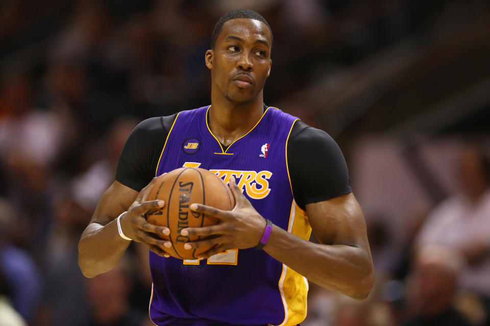 SAN ANTONIO, TX - APRIL 21:  Dwight Howard #12 of the Los Angeles Lakers during Game One of the Western Conference Quarterfinals of the 2013 NBA Playoffs at AT&T Center on April 21, 2013 in San Antonio, Texas. NOTE TO USER: User expressly acknowledges and agrees that, by downloading and or using this photograph, User is consenting to the terms and conditions of the Getty Images License Agreement.  (Photo by Ronald Martinez/Getty Images) 