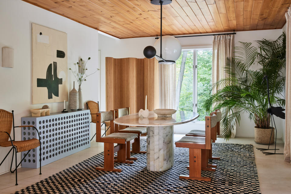 70s style dining room with palm plant by Sarah Sherman Samuel