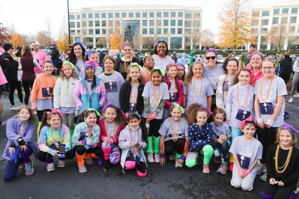 A group shot of participants at a “Girls on the Run” 5K in Charlotte in December 2022. The organization has served more than 2 million young girls since it began as the brainchild of Charlottean Molly Barker in 1996.