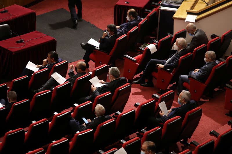 Lebanese members of Parliament attend a legislative session as Lebanon's parliament approved a law that paves the way for the government to ink deals for coronavirus vaccinations, at UNESCO Palace in Beirut