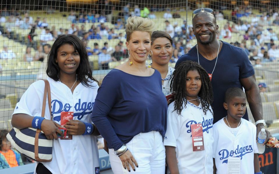 Terry Crews and wife Rebecca King with four of their five children at the Dodger Stadium in Los Angeles in 2013.